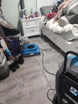 Bedroom water damage restoration equipment.